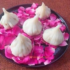 A picture of Ukadiche Modak - Made with Rice Flour, Jaggery and Nuts.
