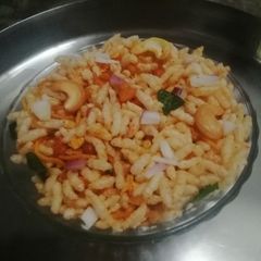 A picture of Masala muri with onion.