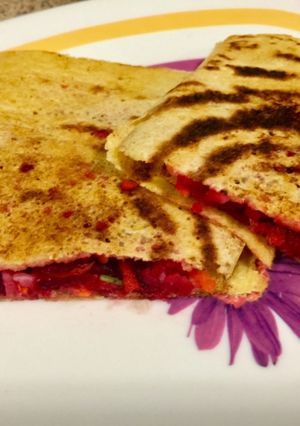 A picture of Moong daal pancakes(chilla) with salad filling.