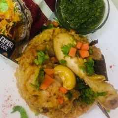Chicken biryani with mint chutney A picture of Chicken biryani with mint chutney.