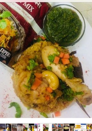 A picture of Chicken biryani with mint chutney.