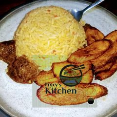 A picture of Jealouf rice with fried plantain.