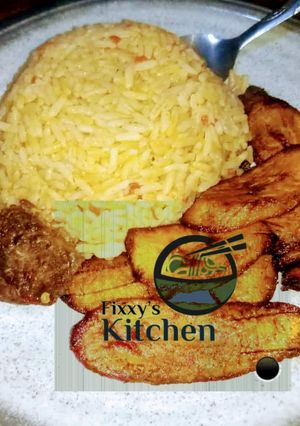 A picture of Jealouf rice with fried plantain.