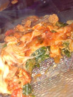 Una foto de Canelones de acelga y ricota con salsa de pollo