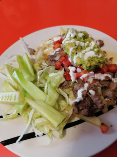 Una foto de Carne asada fríes