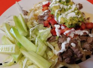 Una foto de Carne asada fríes