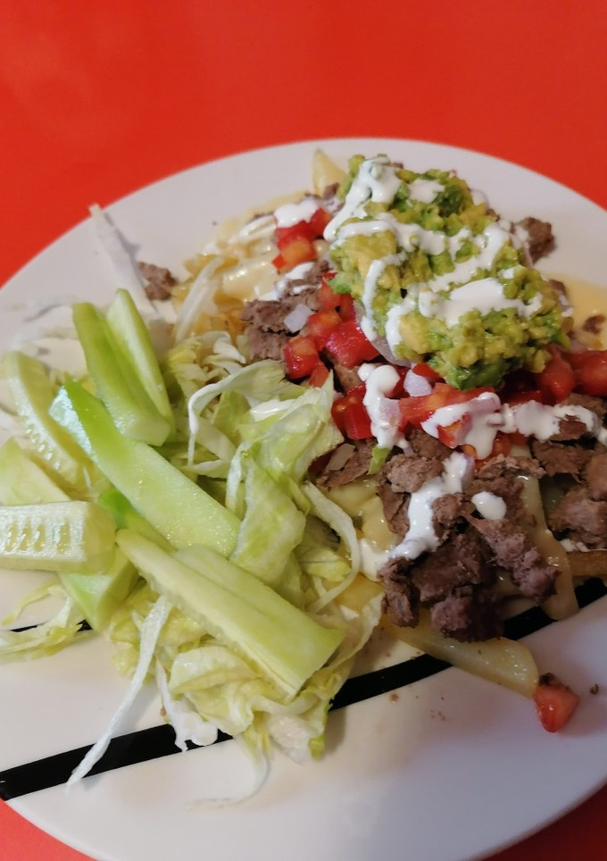 Una foto de Carne asada fríes