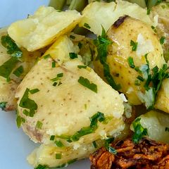 A picture of Crushed Jersey Royals with lashings of butter and lots of herbs #mycookbook.