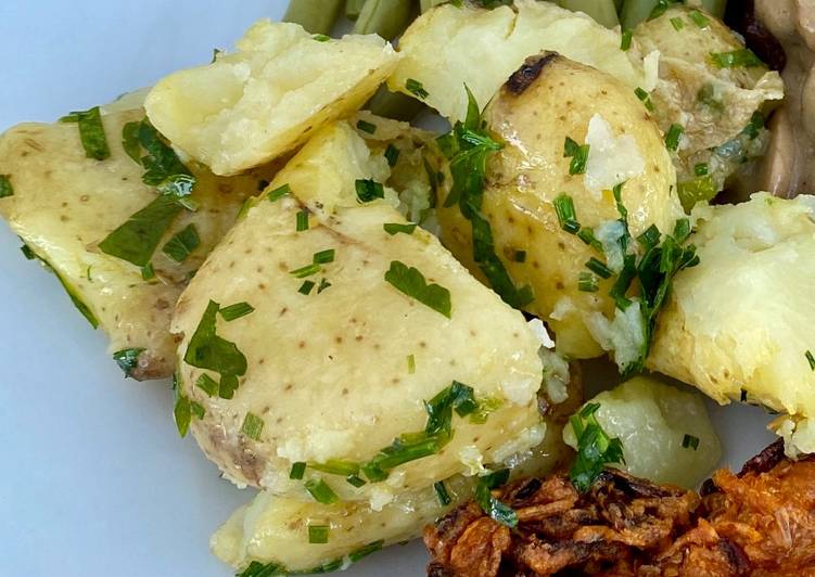 Steps to Prepare Favorite Crushed Jersey Royals with lashings of butter and lots of herbs
