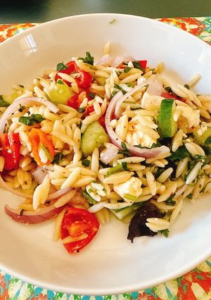 A picture of Greek Salad with Orzo.