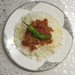 A picture of Rice and meat.