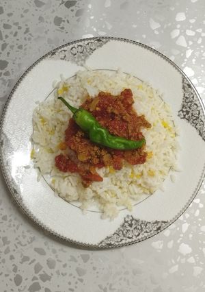 A picture of Rice and meat.
