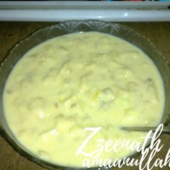 A picture of Pista Fruit Custard.