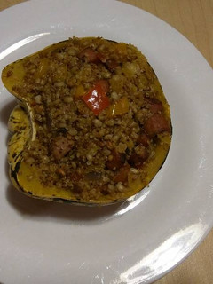 A picture of Stuffed Sweet Dumpling Squash with Sausage.