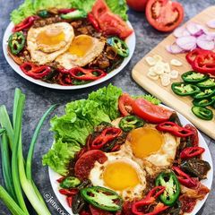 A picture of Telur Ceplok Masak Kecap (Sunny Side Up Eggs with Sweet Soy Sauce).