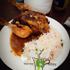 White rice with roasted chicken A picture of White rice with roasted chicken.