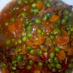 A picture of Beef stew with peas.