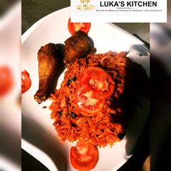A picture of Easy Homemade Jollof Rice Served with Fried Chicken.