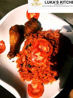 A picture of Easy Homemade Jollof Rice Served with Fried Chicken.