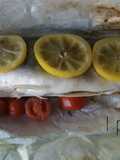 Branzini al forno con pomodorini e limone