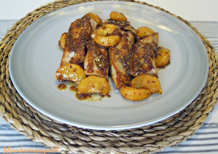 Secreto con mostaza, mandarina y miel