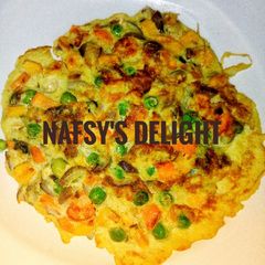 A picture of Veggie and fish fried egg.