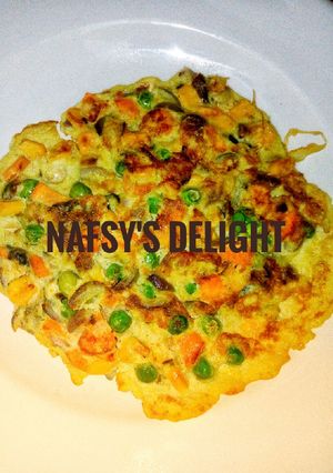A picture of Veggie and fish fried egg.