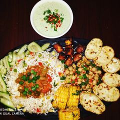 Cottage Cheese Shalmargo with assorted veggiee sizzler A picture of Cottage Cheese Shalmargo with assorted veggiee sizzler.