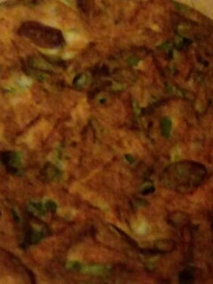 Una foto de Tortilla de espinaca, zanahoria y cebolla