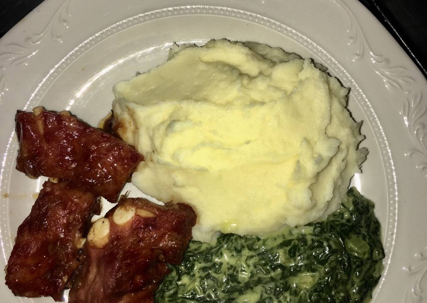 Pork ribs, mash potatoes and cream spinach