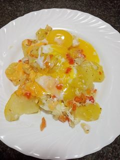 Una foto de Dominó de patatas con huevo