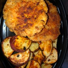 A picture of Salmon patties and ranch roasted potatoes.
