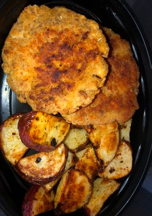 A picture of Salmon patties and ranch roasted potatoes.