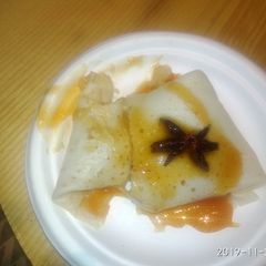 A picture of Anjeerii Dosaa with orange sauce.