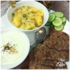 A picture of Jeera aloo with Mooli ka Paratha.