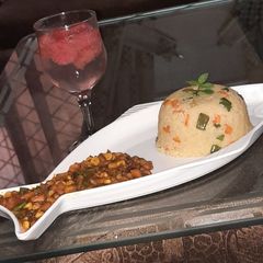 A picture of Stir fried couscous with baked beans sauce.