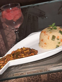 A picture of Stir fried couscous with baked beans sauce.