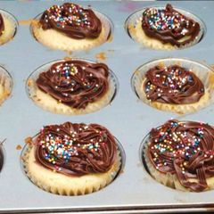 A picture of Mini Vanilla cupcakes with Sparkle frosting.