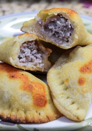 A picture of Mini Calzones with Sausage and Cheese Filling.