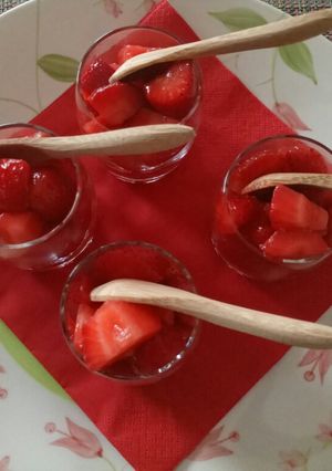 A picture of Martini and strawberry salad.