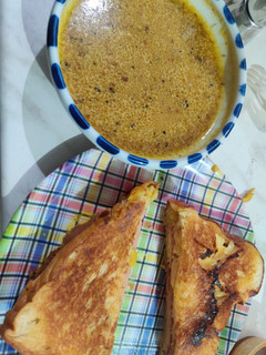 A picture of Grilled Cheese and Pastrami with French Au Jus Dip.