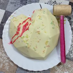 A picture of Heart Shaped Pinata Cake.