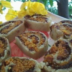 A picture of Carrot Halwa and Bread Swiss Roll.