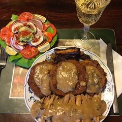 A picture of California Farm Aubergine Eggplant Tenderloin with Poutine Gravy.