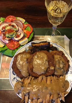 A picture of California Farm Aubergine Eggplant Tenderloin with Poutine Gravy.