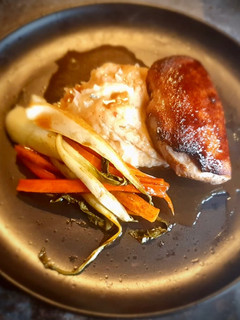 A picture of Glazed Braised Duck Breast on a Signature Mashed Potatoes served with Glazed Carrots and Pak Choi.