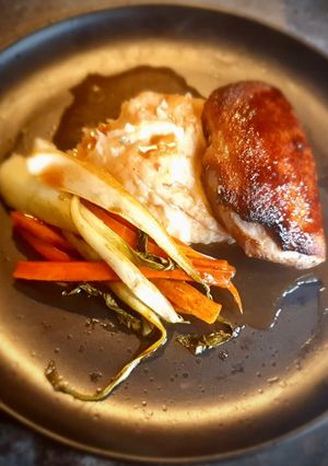 A picture of Glazed Braised Duck Breast on a Signature Mashed Potatoes served with Glazed Carrots and Pak Choi.