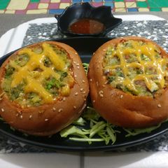 A picture of Beetroot burgers stuffed with Green vegies, paneer & cheese.