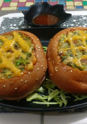 A picture of Beetroot burgers stuffed with Green vegies, paneer & cheese.