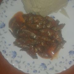 A picture of Small fish with ugali.